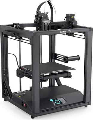 A 3D printer is shown in a studio setting against a white background.
