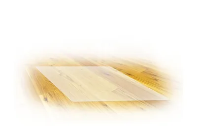 A transparent protective mat is placed on a wooden floor.