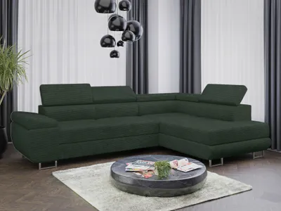 A dark green sectional sofa is shown in a living room setting with curtains and a chandelier.