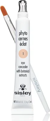 A product shot of a Sisley eye concealer with an applicator brush.