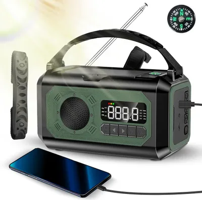 A survival radio is shown with a smartphone charging from it, and a compass is visible in the background.