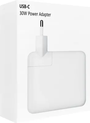 A white box with a white power adapter partially visible inside.