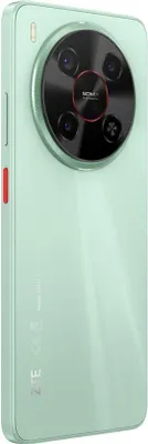 The back of a light green smartphone with a prominent circular camera module.
