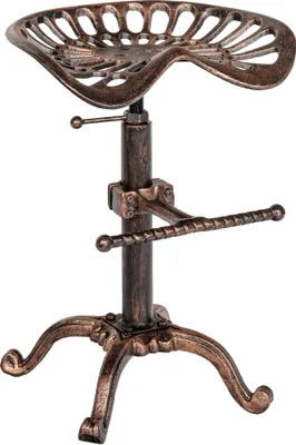 A bronze-colored tractor seat stool on a white background.
