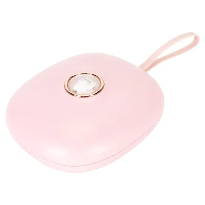 A pink, oval-shaped electronic device with a gold-rimmed circular detail and a pink strap, set against a white background.