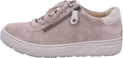 A side view of a beige sneaker.