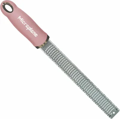 A pink and silver Microplane grater on a white background.