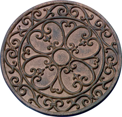 A round, decorative stepping stone with an ornate, wrought-iron-like pattern.