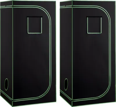 Two black grow tents with green trim are shown side-by-side against a white background.