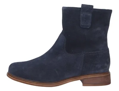 A side view of a single blue suede boot.