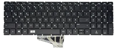 A black keyboard with German keycaps, shown from a top-down perspective against a white background.