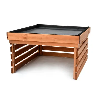 Image de Le garage en bois pour la tondeuse robotisée mesure 78 x 84 x 50 cm et dispose d'un espace sur le toit pour faire pousser des plantes.