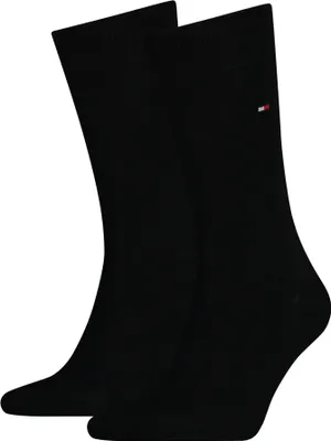 A pair of black socks is shown against a white background.