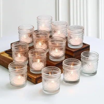 Immagine prodotto di Set di 12 portacandele in vetro, stile vintage, con motivo a rilievo, ideali per candele votive, perfetti per la decorazione della tavola, in vetro trasparente