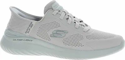 A side view of a gray Skechers sneaker.