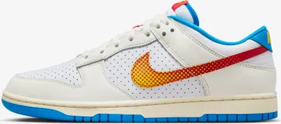 A side view of a Nike Dunk Low Retro sneaker in a studio setting.