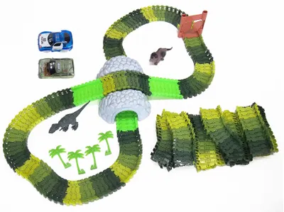 Produktbild von Amewi Magic TRAXX Rennbahn 374tlg Mega Set Dino Park Autorennen mit Tunnel Box