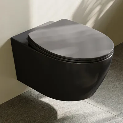 A black wall-mounted toilet with a gray lid, shown in a bathroom setting with tiled flooring and a wall with shadows cast on it.