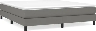 A bed frame with a mattress on top, shown from a side angle against a white background.