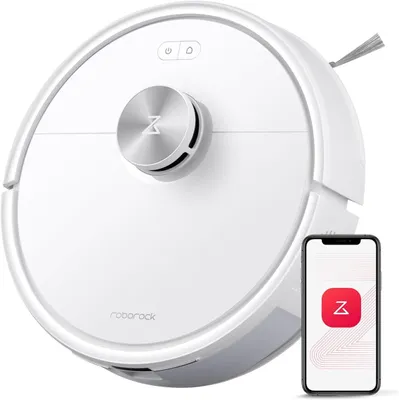 A white Roborock Q7 M5 robot vacuum cleaner is shown from a top-down perspective, with a smartphone displaying the Roborock app next to it.