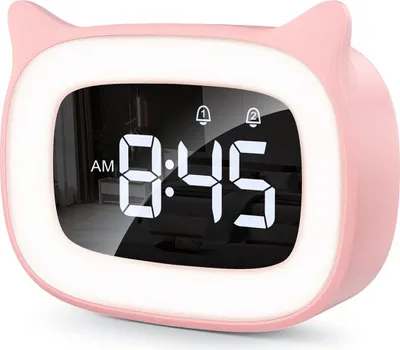 A pink cat-shaped alarm clock with a digital display showing the time.