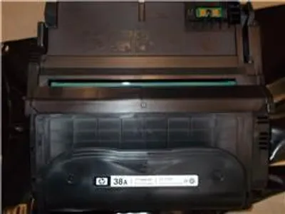 A close-up view of a black HP toner cartridge.