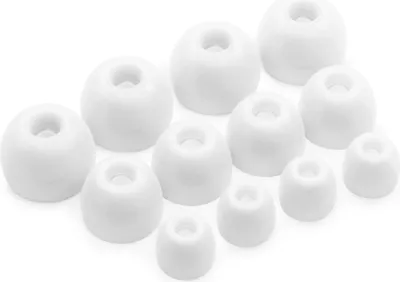 A collection of white silicone earbud tips of various sizes arranged on a white background.