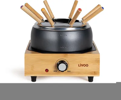 A Livoo fondue pot set on a wooden base, with fondue forks inserted.
