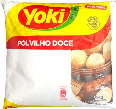 A bag of Yoki Polvilho Doce (sweet tapioca starch) with an image of baked goods and cassava roots.