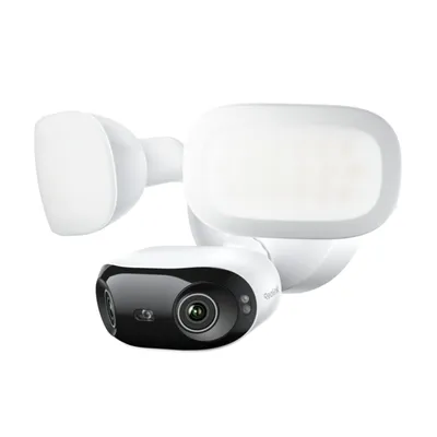 A white floodlight security camera with a black camera lens is shown against a white background.