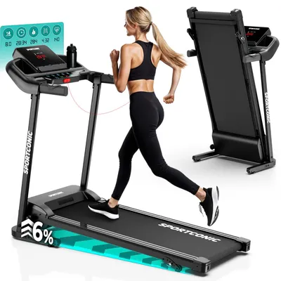 A woman is running on a treadmill in a home setting. Another treadmill is folded and standing upright in the background.