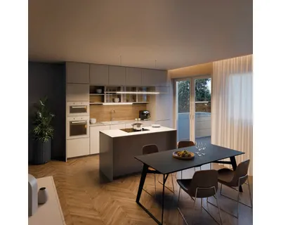 A modern kitchen and dining area with a sleek island and dining table.