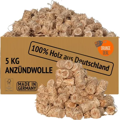 A cardboard box filled with fire starters, with a pile of fire starters in front of it.