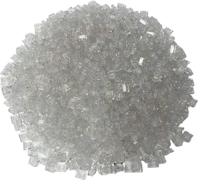 A pile of small, transparent, square-shaped LEGO bricks.