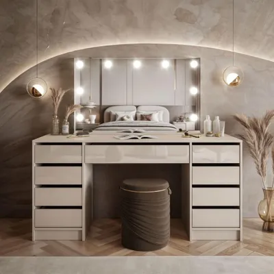 A modern bedroom with a vanity table and bed.