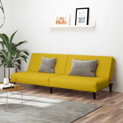 A yellow sofa with two gray cushions in a living room setting.