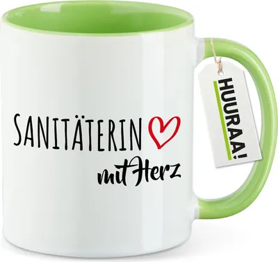 Produktbild von Huuraa Kaffeetasse Sanitäterin mit Herz 330ml Grün Keramik Kaffeebecher Geschenkidee