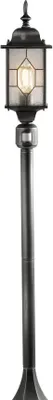 A black and silver outdoor lamp post.