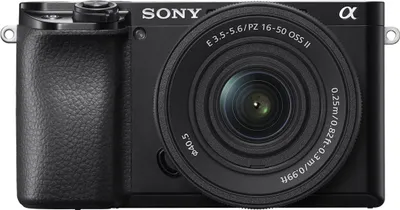 A close-up front view of a black Sony Alpha mirrorless camera with a lens attached.