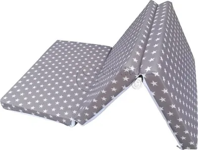 A folded mattress with a star pattern.