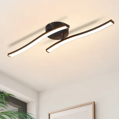 A modern LED ceiling light with a curved design, mounted on a white ceiling.