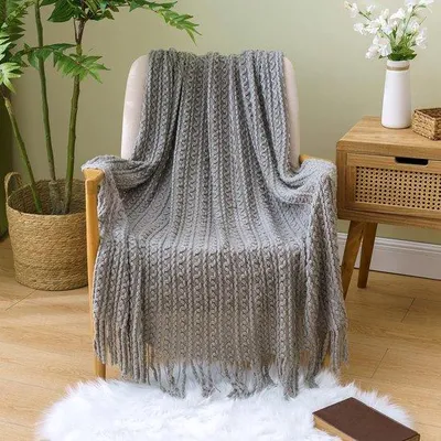 Immagine prodotto di Unyqoos® Coperta avvolgente 125 x 150 cm – Plaid bohémien in maglia, realizzato al 100% in acrilico, morbida e calda, di colore grigio unito, ideale come coperta per divano, letto, poltrona e ufficio