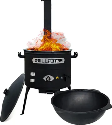 A black cast iron cooking pot with a chimney and flames, along with a separate lid and a bowl.