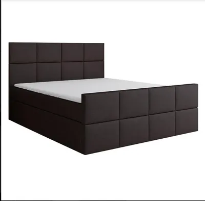 A dark brown upholstered bed with a mattress, displayed against a white background.