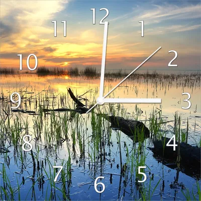 Produktbild von Wallario Design Wanduhr Schilf am Abend - Sonnenuntergang über der Seelandschaft aus Echtglas, Größe 30 x 30 cm