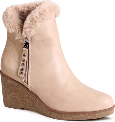 A single beige wedge bootie with faux fur trim is shown against a white background.