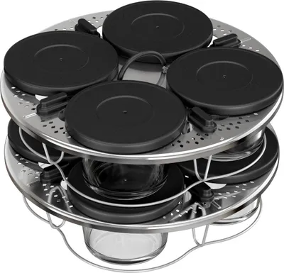 A multi-tiered stainless steel steamer basket with black lids on top and glass containers below.