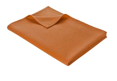 A folded blanket on a white background.