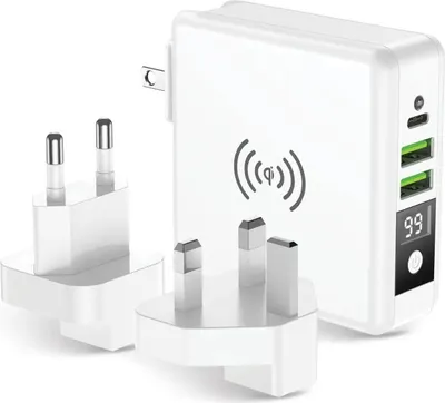 A white universal travel charger with multiple plug adapters and a wireless charging symbol.