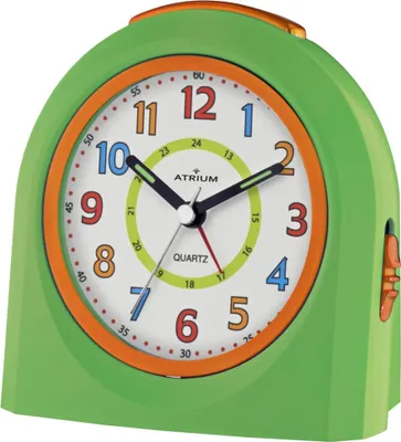 A close-up studio shot of a green and orange analog alarm clock.